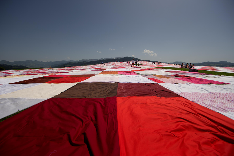 Illustration for article titled The World's Biggest Picnic Blanket Is Growing in the Swiss Countryside
